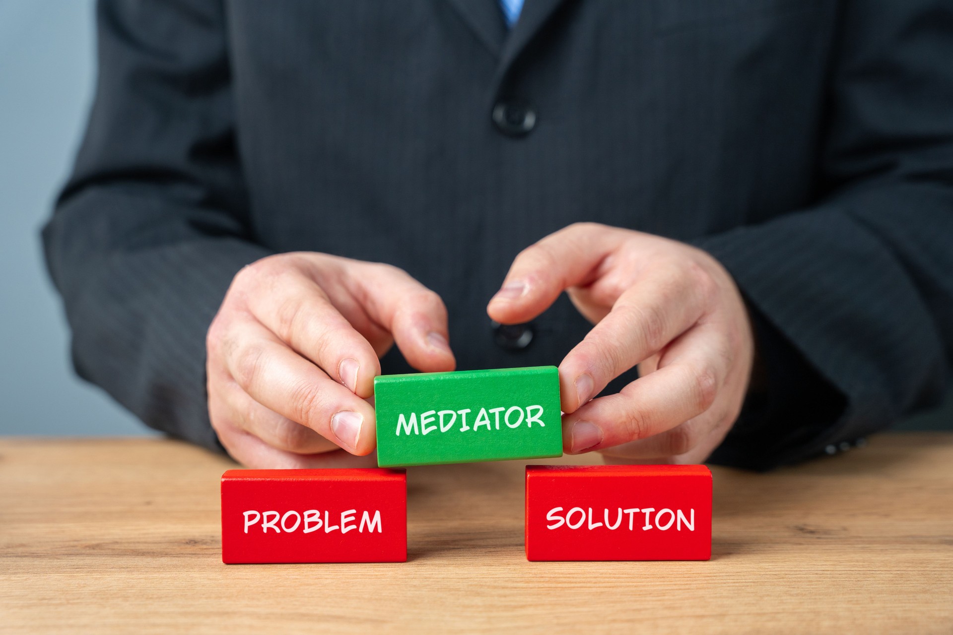 Wooden blocks with the word Mediation problem solution. Settlement of disputes by mediation. Dispute Resolution. Third party, intermediary.